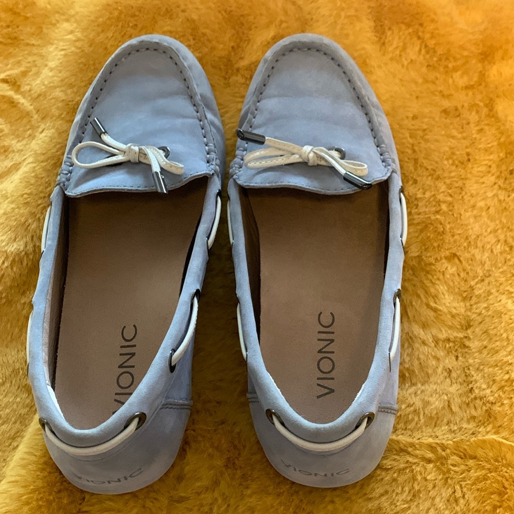 Vionic light blue suede flats with a grip type rubber sole.